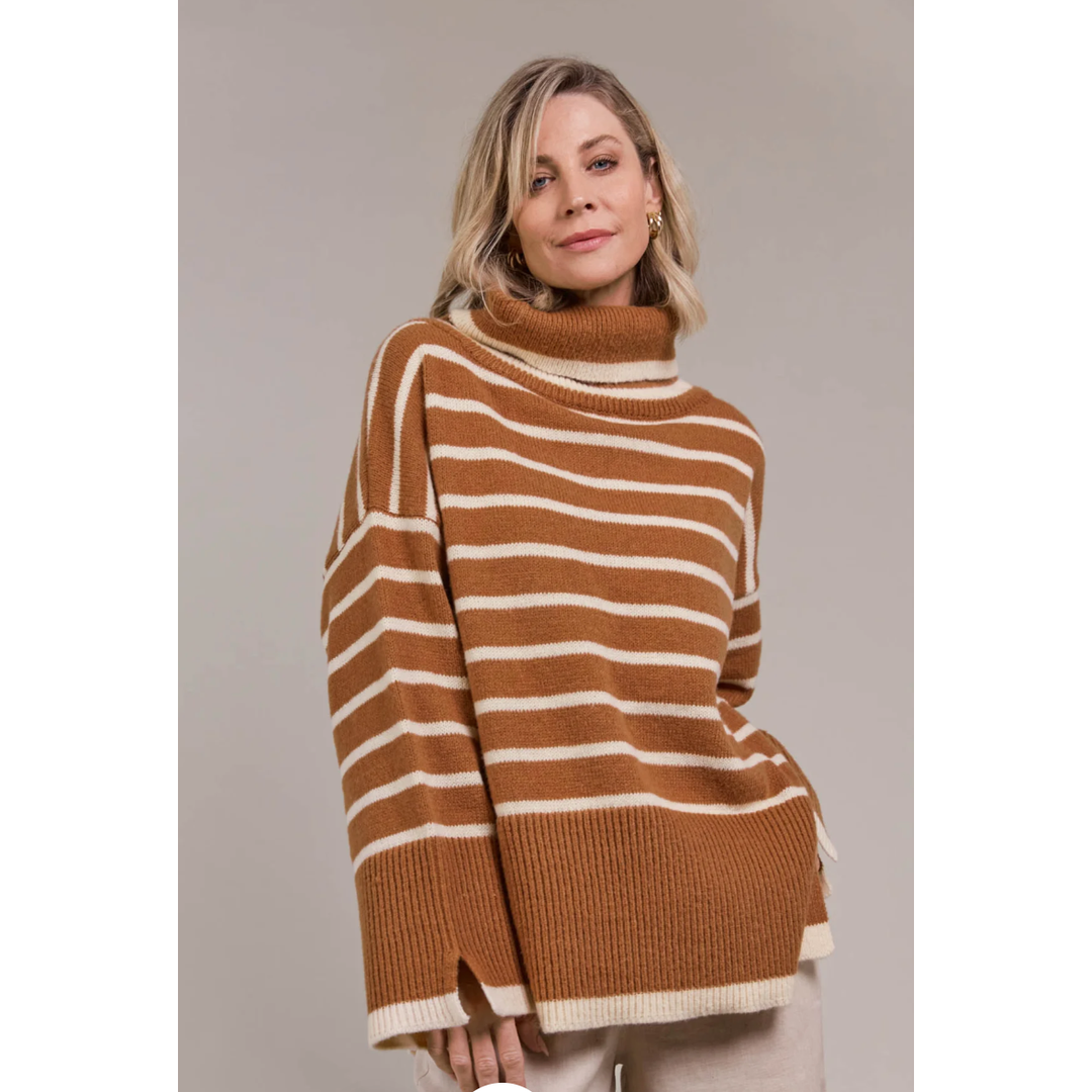 Katana Roll Neck Knit

The Katana Roll Neck Knit strikes a balance between timeless and modern, made from sustainably sourced 100% recycled polyester. Its oversized fit and roll neck make it ideal for layering during the colder months. Horizontal stripes lend visual appeal, complemented by vents on the sleeves and hem. Style it effortlessly with linen pants or jeans and comfortable flats for laid-back days.

