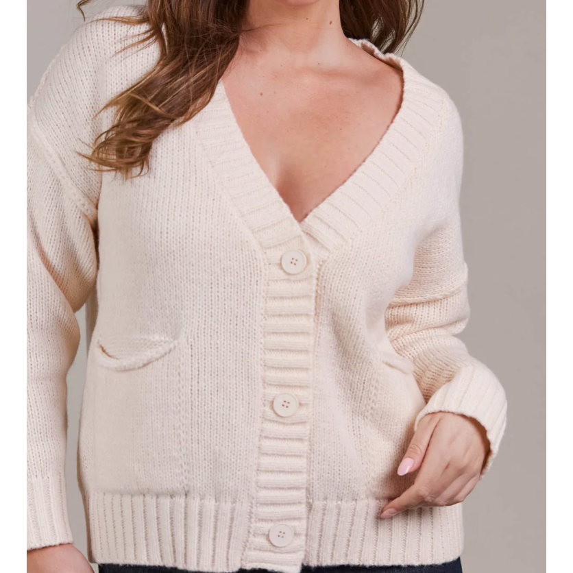 Katana Cardigan

For easy off-duty style, the Katana Cardigan is a perfect pick. Made from plush recycled polyester, this soft knit offers a classic V-neckline with a three-button front and bold ribbed detailing. A true transeasonal essential, it seamlessly complements your wardrobe basics. Style it with denim for a comfortable yet chic look.