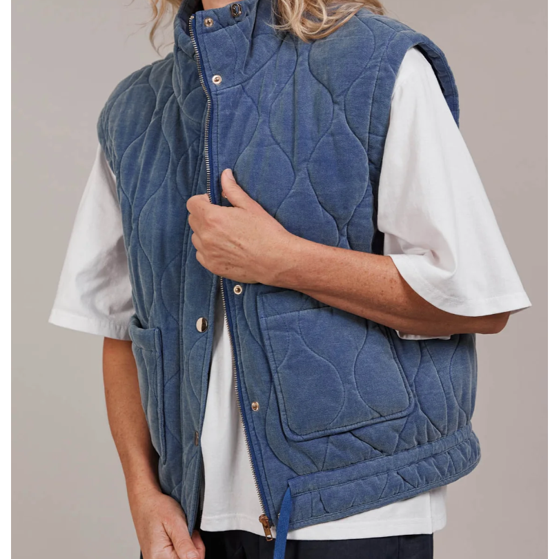 Pepi Vest

Designed with purpose, the Pepi Vest is crafted from 100% cotton and features a practical zip and press stud closure, convenient patch pockets, and an adjustable drawstring for the perfect fit. Quilted detailing adds a soft, textured touch, giving this puffer a unique look. A new essential you didn't know you needed, it layers effortlessly over activewear or loungewear for the ideal throw-on style.