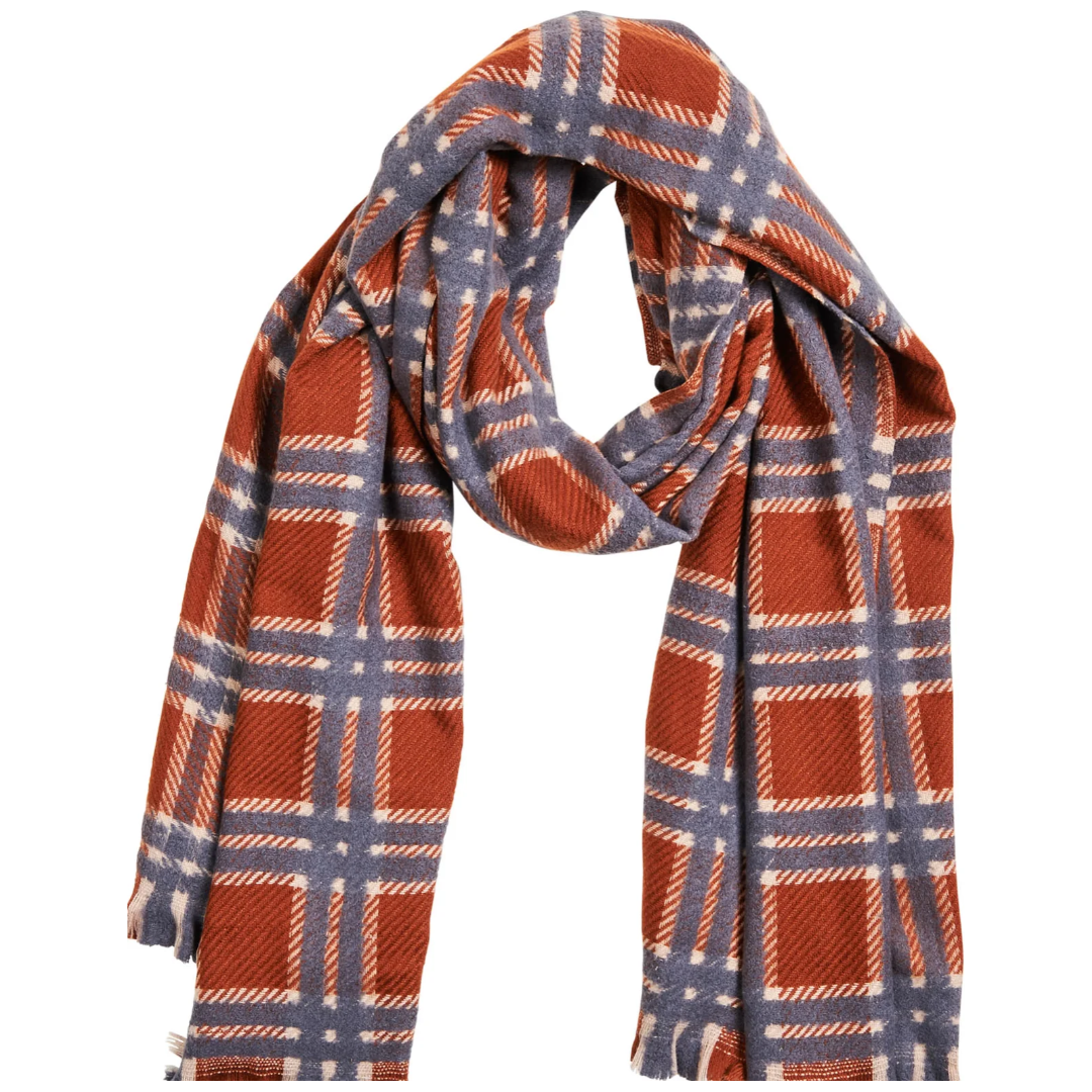 Aman Scarf

The Aman Scarf perfectly balances style and comfort, making it your new go-to for chilly mornings. This thick, winter-ready scarf boasts a chic checkered design that complements your polished looks. Finished with a fringed edge, you can easily drape it over your shoulders or wrap it around your neck.