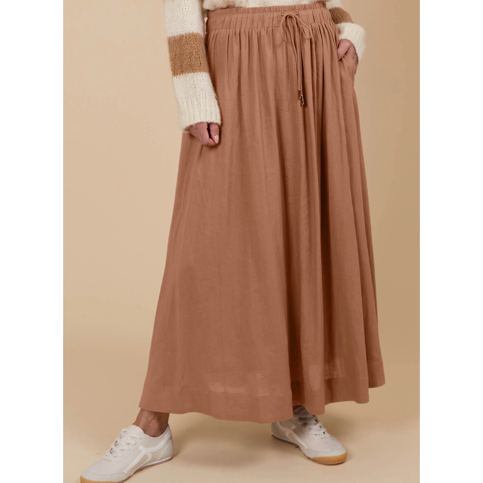 Venus Skirt -Toffee

The Venus Skirt seamlessly transitions from your 9-5 to 5-9 plans. Its flowing A-line silhouette adds a soft, feminine feel, enhanced by the comfortable elastic waist and adjustable drawstring. Available in our neutral seasonal palette, this skirt pairs effortlessly with your favourite wardrobe staples. Wear it with a classic knit and loafers for the office, then switch to a stylish blouse, boots, and statement accessories for a night out.