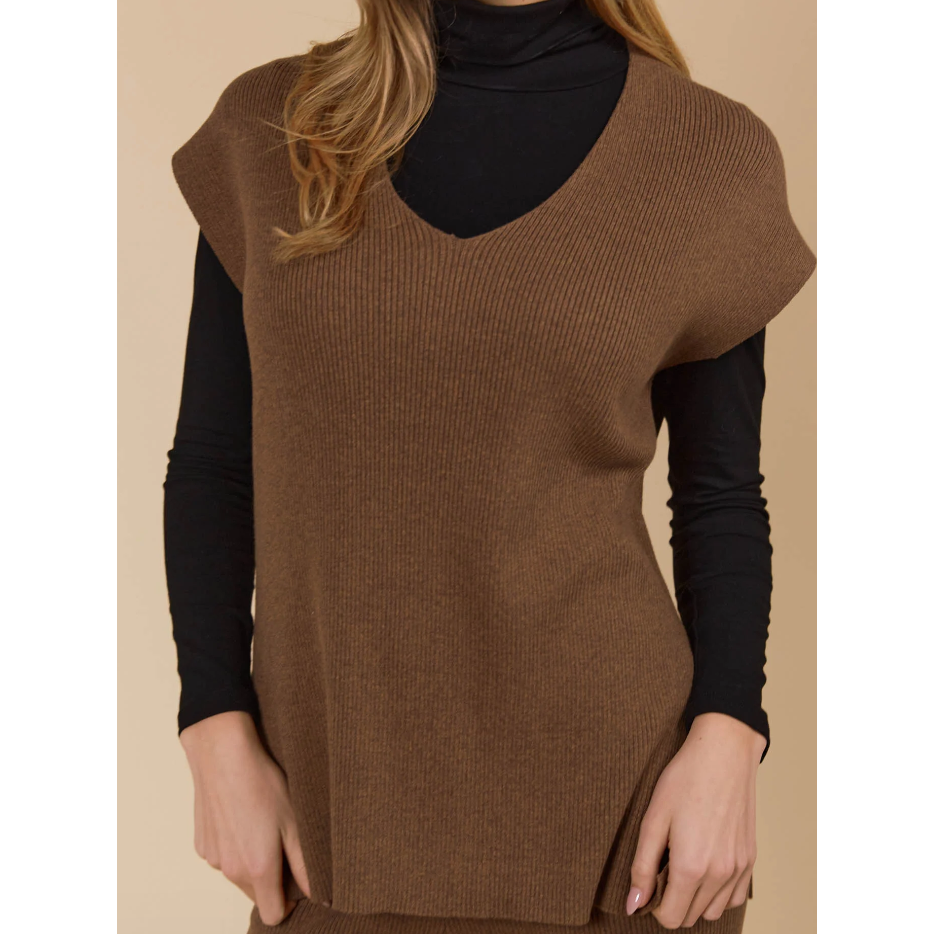 Tala Knit Vest

The Tala Knit Vest is designed to seamlessly take you from autumn through winter. Made from a cotton-rich knit, it offers versatile layering options, whether styled under a lightweight jacket or worn over a shirt or long-sleeve top. With a V-neckline, cap sleeves, and side vents, this vest adds a polished touch to any outfit.