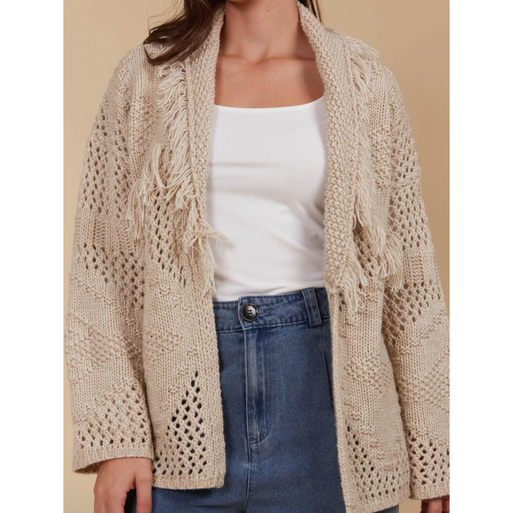 Luna Cardigan - Canvas

Answer the call of cosy days with the Luna Cardigan. Made from a luxurious wool blend, this cardigan combines ultimate softness with elevated style. Its standout features—a fringed lapel, open-front silhouette, and bold contrasting weave—make it perfect for relaxed moments at home or casual days on the go. Pair it with a t-shirt and relaxed-fit pants for a look that's as chic as it is comfortable.