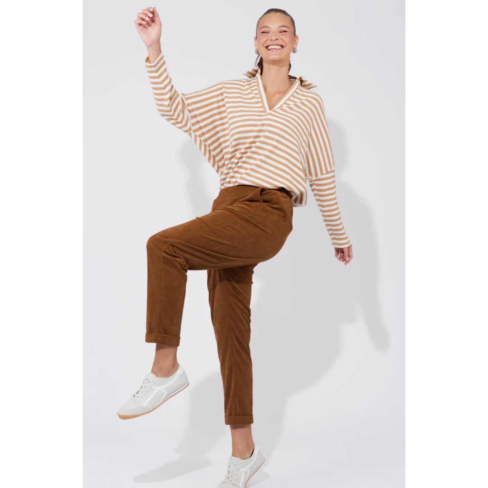 Nashville Pant - Dune

Corduroy never looked so good. The Nashville Pant features a classic and adaptable design, highlighted by a smooth, flat elastic waist and a chic tapered ankle length. The relaxed drop crotch and luxuriously soft fabric make these pants a perfect choice for days when denim feels too restrictive. Achieve a preppy, polished look by pairing them with a long-sleeve top, a cosy knit vest, and loafers.