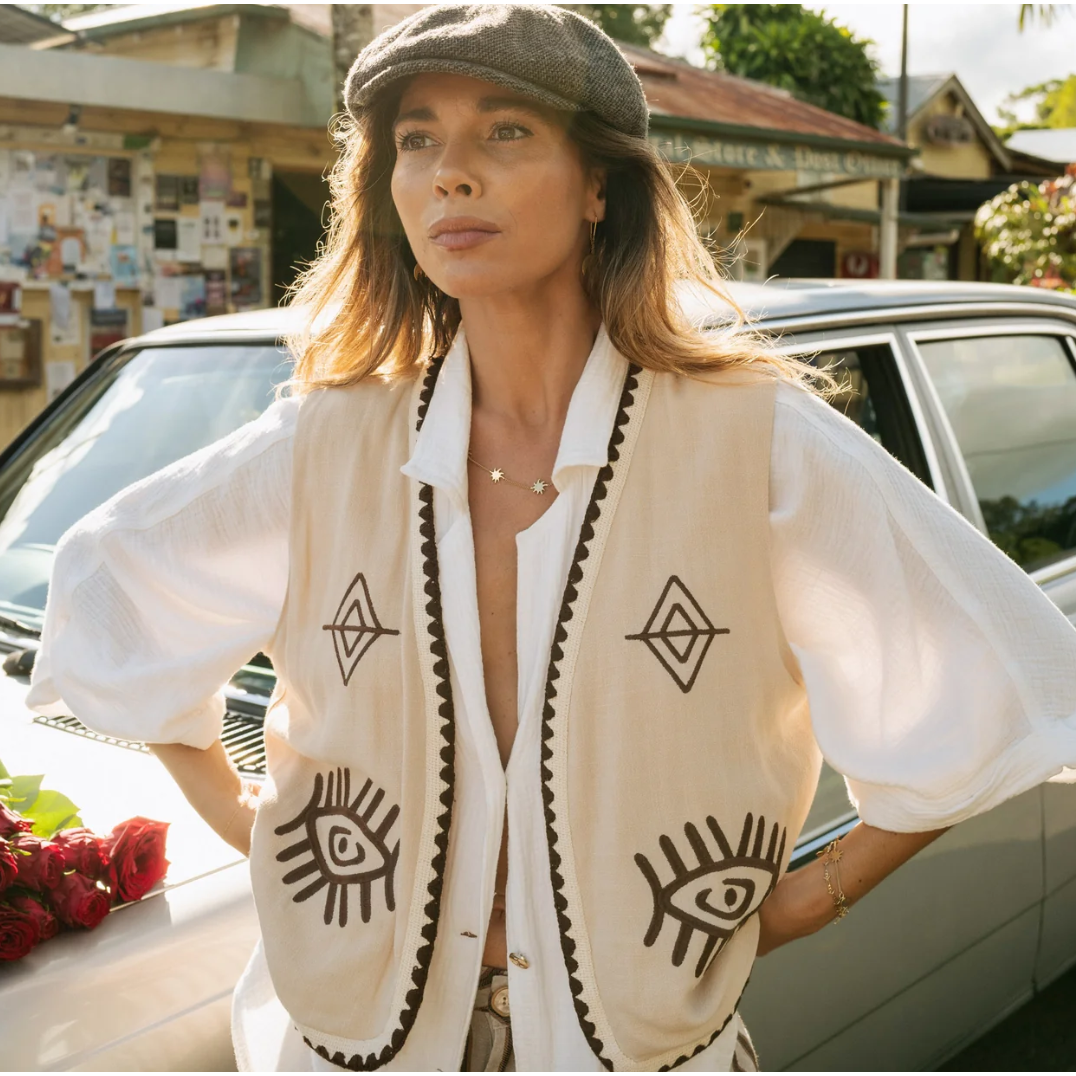 Boho Vest - Hazel

Introducing our Hazel Vest - with carefully thought out brown embroidery that adds depth and character. Crafted from lightweight cotton, it ensures a more flowy, laidback fit compared to your standard structured vest.Embrace the versatility by layering it over a shirt/dress showing your personal style!