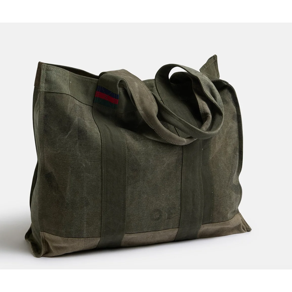 Land of Mates Tote-Kahki

50/40/14cm



The Land of Mates Tote combines eco-conscious design with rugged urban style. Made from upcycled truck canvas, each bag features unique, faded prints that give it a raw, industrial charm. The minimalist design and durable material make it the perfect tote for city dwellers who value individuality and sustainability. Whether you're commuting or running errands, the Land of Mates Tote is a statement piece that embodies both style and eco-conscious craftsmanship