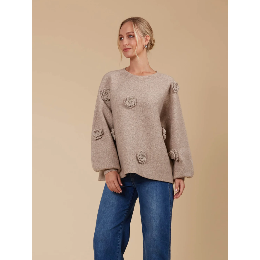 Miru Flower Jumper - Taupe

Keep the floral trend alive all year with the Miru Flower Jumper! This cowy piece is adorned with beautiful floral applique and made from a soft, warm blend of wool and recycled polyester. Whether you pair it with your favourite denim for a relaxed, off-duty look or layer it under a winter coat, the Miru Flower Jumper is perfect for any occasion.