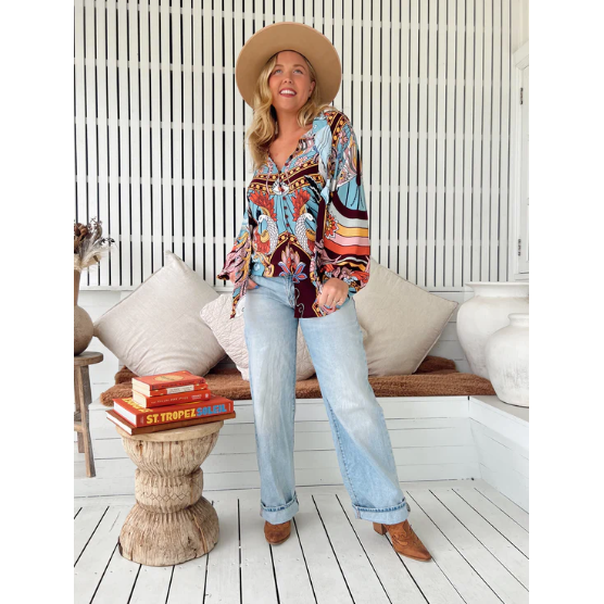 Wild Hearts Imogen Blouse

Detailed and delicate this blouse is the perfect way to dress up any outfit. The centre bust features buttons with tassel neckties. The sleeves are a long relaxed fit with loose gathered elastic cuff.