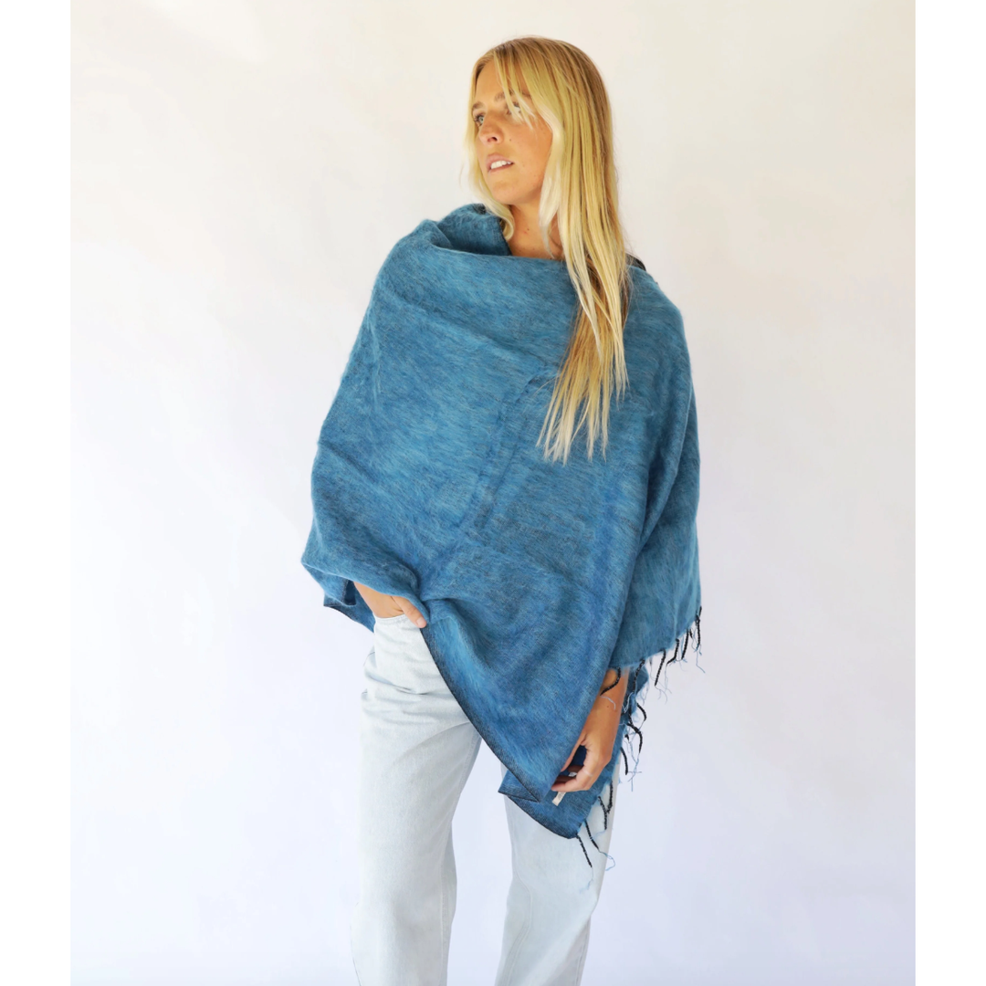 Our Ponchos are a go-to for the moments when you need that extra warmth without sacrificing practicality. Whether you’re&nbsp;on the go, or simply enjoying a cuppa and a good read this piece will always be there for you.

Pair this piece with your favourite denim and sneakers for a casual ever