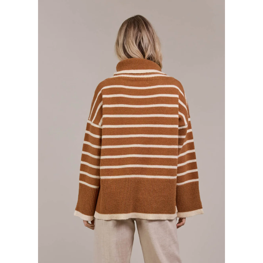Katana Roll Neck Knit

The Katana Roll Neck Knit strikes a balance between timeless and modern, made from sustainably sourced 100% recycled polyester. Its oversized fit and roll neck make it ideal for layering during the colder months. Horizontal stripes lend visual appeal, complemented by vents on the sleeves and hem. Style it effortlessly with linen pants or jeans and comfortable flats for laid-back days.

