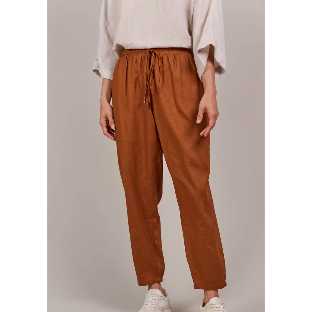 Laax Relaxed Pants-Hazel

The Laax Relaxed Pant is designed for everyday ease and seasonal versatility. With a comfortable elastic waist, adjustable drawstring, and tapered ankle-length cut, it offers a relaxed silhouette that's both stylish and practical. The blend of linen and cotton ensures breathability and long-lasting wear. For an effortless casual look, pair it with a linen top or t-shirt and sneakers.