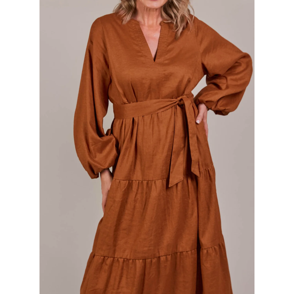 Laax Maxi Dress- Hazel

From a wine tasting with the girls to a romantic dinner date, the Laax Maxi Dress adds a touch of effortless elegance to any event. The dress flows gracefully with a flattering V-neck and dramatic bishop sleeves, creating a stunning silhouette. A self-fabric tie cinches the waist, accentuating your shape. Complete your look with heels or boots, eye-catching accessories, and a chic clutch.