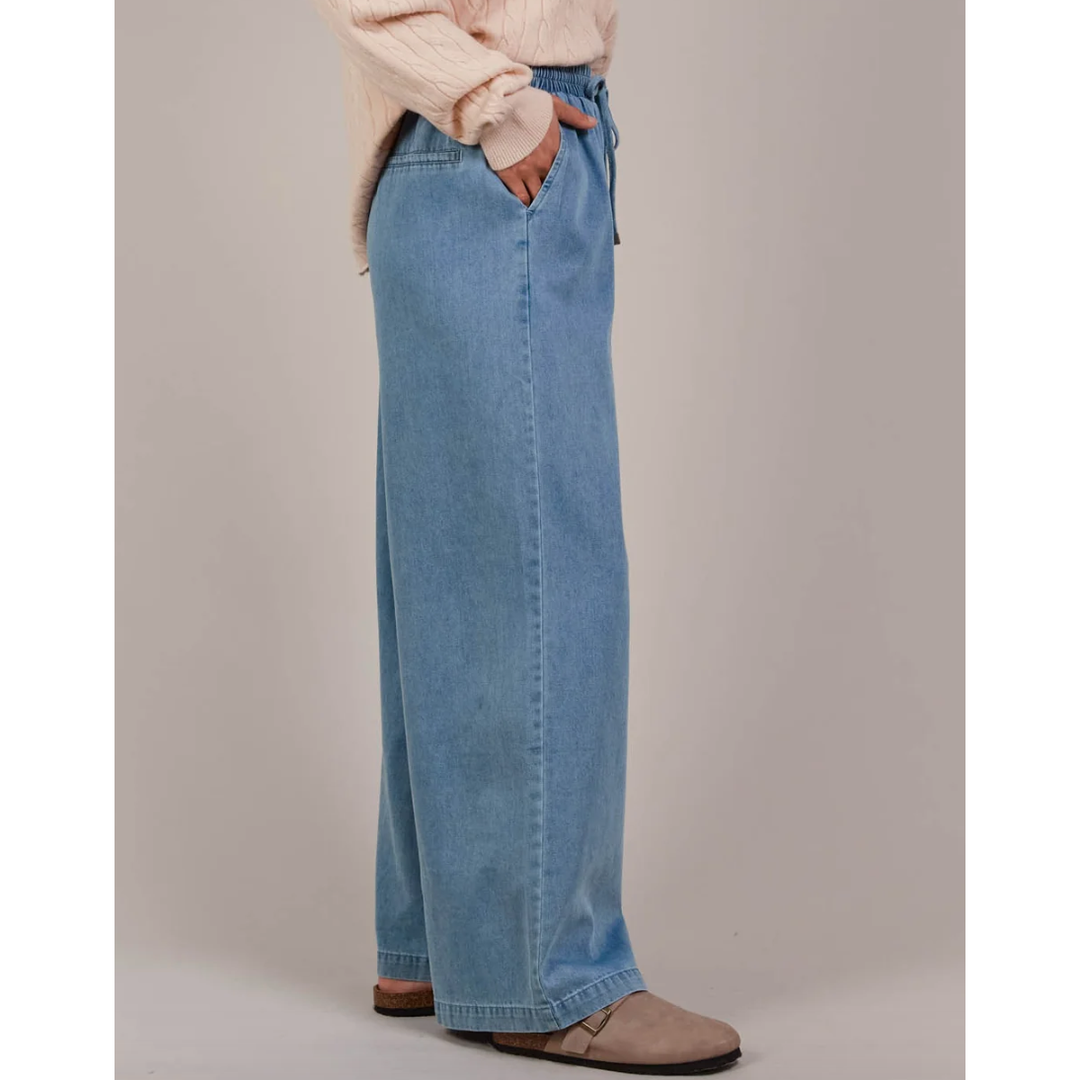 Pepi Wide Denim Pants

The Pepi Wide Denim Pant brings a fresh, modern feel to a timeless style with its wide-leg silhouette. Thoughtfully designed with inseam pockets for added practicality, it features an elastic waistband and an adjustable drawstring for a custom fit. Made from ultra-soft cotton denim, these pants are comfortable and versatile enough for any season. Wear them with a cosy knit and ballet flats for a laid-back, stylish look.