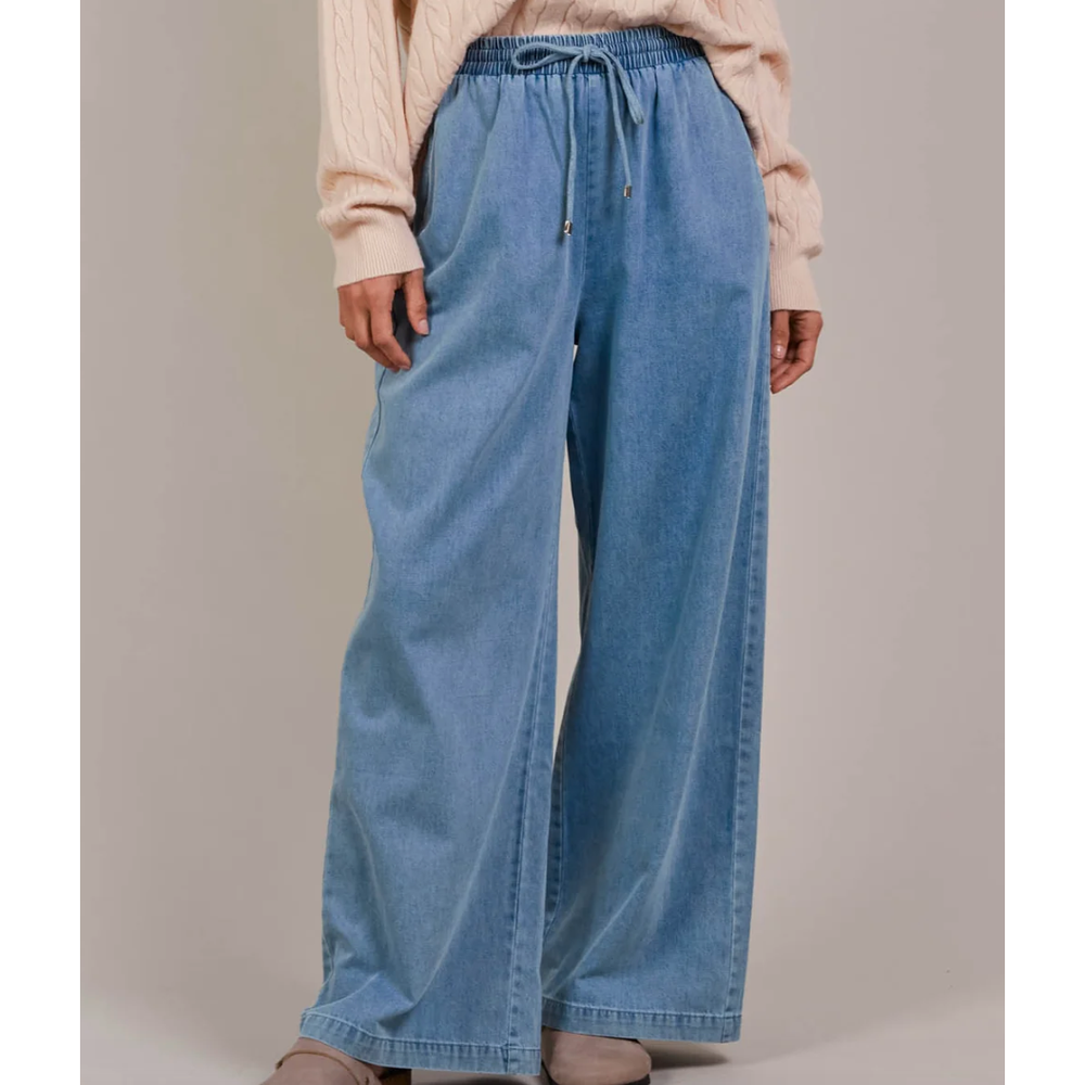 Pepi Wide Denim Pants

The Pepi Wide Denim Pant brings a fresh, modern feel to a timeless style with its wide-leg silhouette. Thoughtfully designed with inseam pockets for added practicality, it features an elastic waistband and an adjustable drawstring for a custom fit. Made from ultra-soft cotton denim, these pants are comfortable and versatile enough for any season. Wear them with a cosy knit and ballet flats for a laid-back, stylish look.