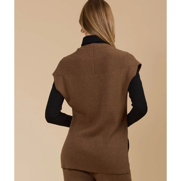 Tala Knit Vest

The Tala Knit Vest is designed to seamlessly take you from autumn through winter. Made from a cotton-rich knit, it offers versatile layering options, whether styled under a lightweight jacket or worn over a shirt or long-sleeve top. With a V-neckline, cap sleeves, and side vents, this vest adds a polished touch to any outfit.