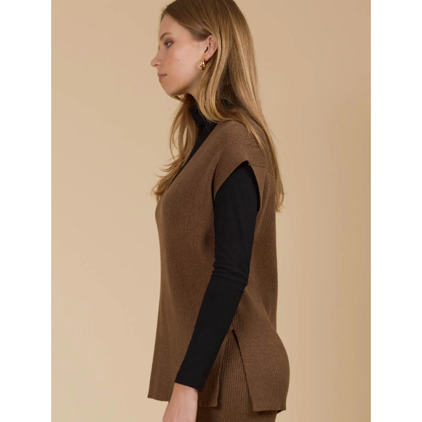 Tala Knit Vest

The Tala Knit Vest is designed to seamlessly take you from autumn through winter. Made from a cotton-rich knit, it offers versatile layering options, whether styled under a lightweight jacket or worn over a shirt or long-sleeve top. With a V-neckline, cap sleeves, and side vents, this vest adds a polished touch to any outfit.