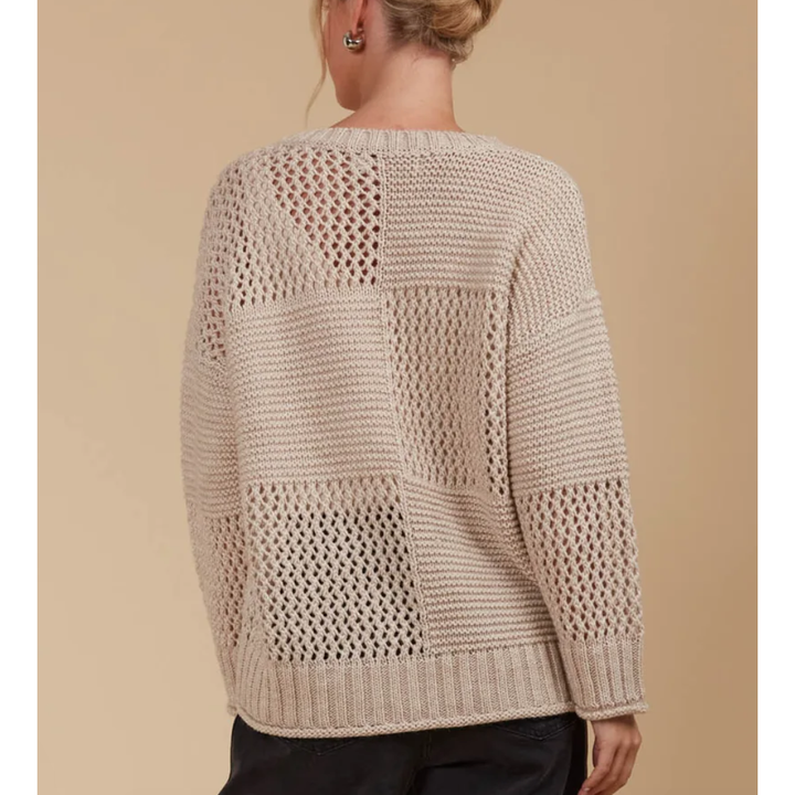 Luna Jumper - Canvas

The Luna Jumper is your new excuse to live in knitwear. This classic knit gets a modern twist with a unique contrasting weave pattern in a perfect-for-the-season colour palette. Its relaxed fit makes it a layering pro—whether you're throwing it over a light tee or under a heavier coat. Crafted in a cosy wool blend, this knit is made for cooler days. Pair it with your go-to jeans, a snug scarf, and comfy loafers for a laid-back seasonal vibe.