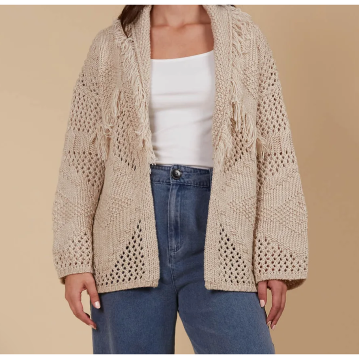 Luna Cardigan - Canvas

Answer the call of cosy days with the Luna Cardigan. Made from a luxurious wool blend, this cardigan combines ultimate softness with elevated style. Its standout features—a fringed lapel, open-front silhouette, and bold contrasting weave—make it perfect for relaxed moments at home or casual days on the go. Pair it with a t-shirt and relaxed-fit pants for a look that's as chic as it is comfortable.