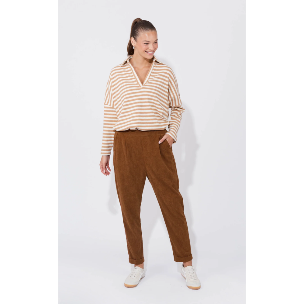 Nashville Pant - Dune

Corduroy never looked so good. The Nashville Pant features a classic and adaptable design, highlighted by a smooth, flat elastic waist and a chic tapered ankle length. The relaxed drop crotch and luxuriously soft fabric make these pants a perfect choice for days when denim feels too restrictive. Achieve a preppy, polished look by pairing them with a long-sleeve top, a cosy knit vest, and loafers.