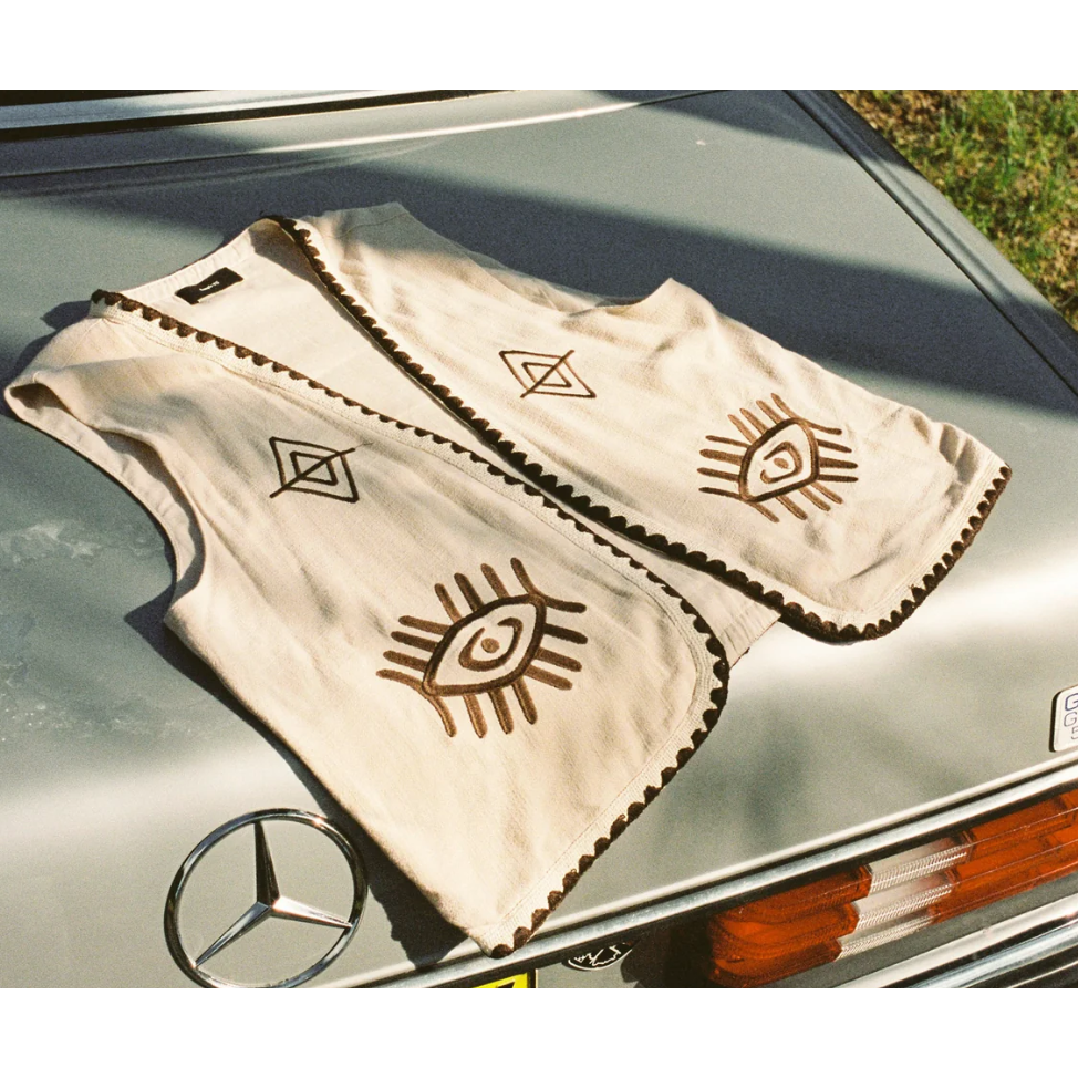 Boho Vest - Hazel

Introducing our Hazel Vest - with carefully thought out brown embroidery that adds depth and character. Crafted from lightweight cotton, it ensures a more flowy, laidback fit compared to your standard structured vest.Embrace the versatility by layering it over a shirt/dress showing your personal style!