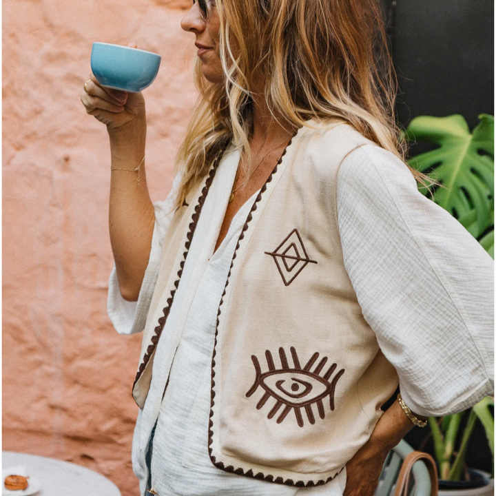 Boho Vest - Hazel

Introducing our Hazel Vest - with carefully thought out brown embroidery that adds depth and character. Crafted from lightweight cotton, it ensures a more flowy, laidback fit compared to your standard structured vest.Embrace the versatility by layering it over a shirt/dress showing your personal style!
