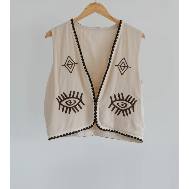 Boho Vest - Hazel

Introducing our Hazel Vest - with carefully thought out brown embroidery that adds depth and character. Crafted from lightweight cotton, it ensures a more flowy, laidback fit compared to your standard structured vest.Embrace the versatility by layering it over a shirt/dress showing your personal style!
