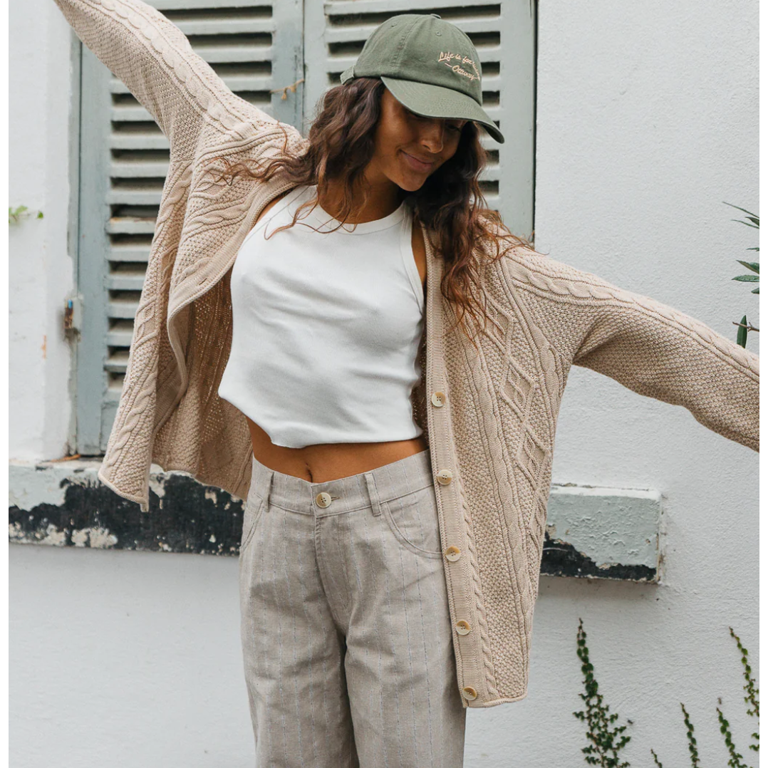 Cohen Unisex Cable Knit Cardigan

Style borrowed from nostalgia... the Cohen Cardigan provides a laid back look with a snug feel. Crafted from the softness linen and cotton with a cable knit finish, it has a draped fit designed to be worn open over your favourite outfit or buttoned up for extra warmth.