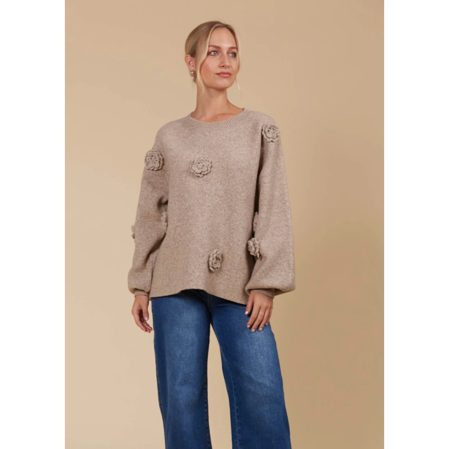 Miru Flower Jumper - Taupe

Keep the floral trend alive all year with the Miru Flower Jumper! This cowy piece is adorned with beautiful floral applique and made from a soft, warm blend of wool and recycled polyester. Whether you pair it with your favourite denim for a relaxed, off-duty look or layer it under a winter coat, the Miru Flower Jumper is perfect for any occasion.